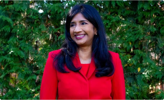 Aruna Miller, public servant and engineer, smiling during a campaign event in Maryland